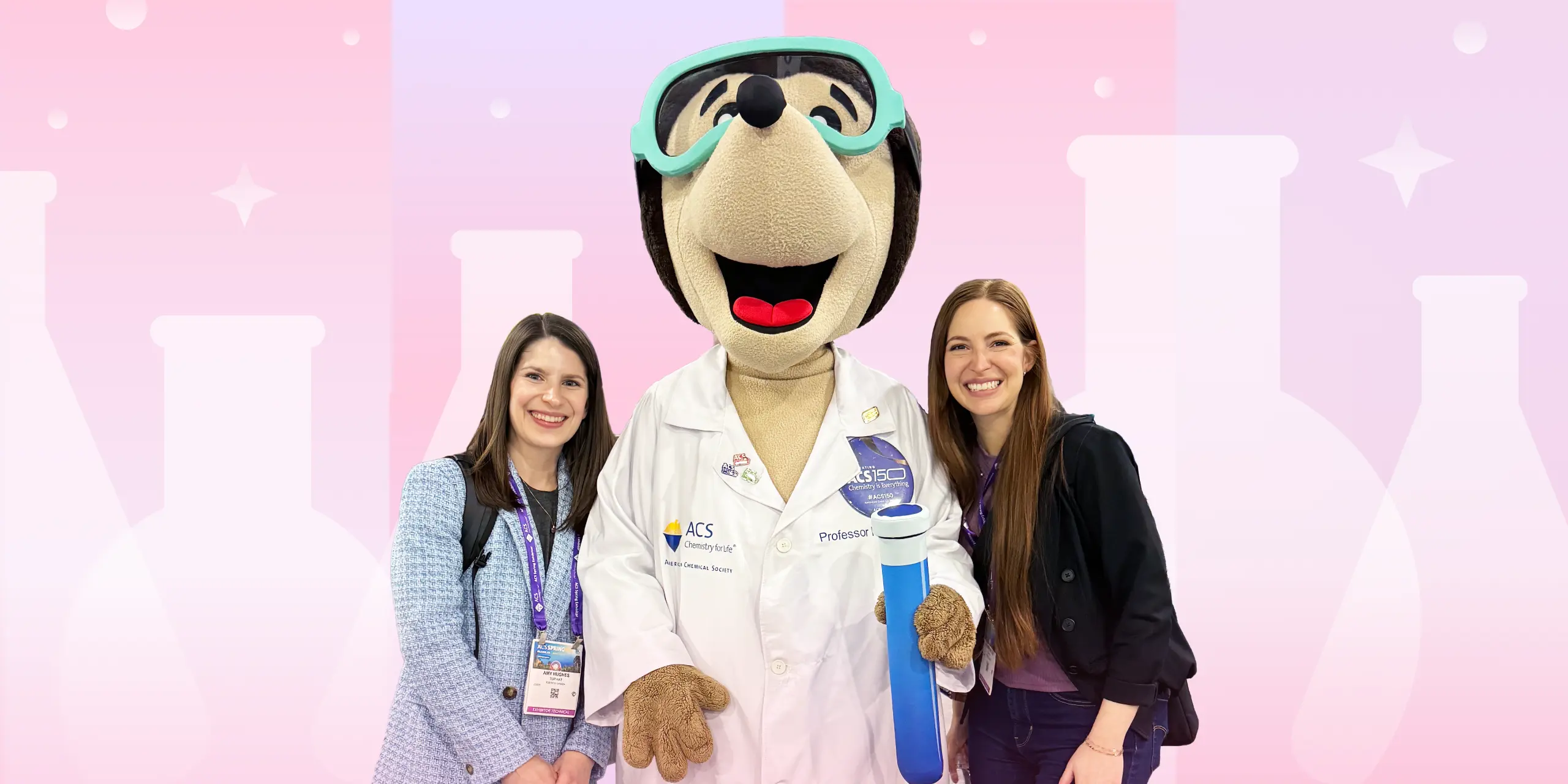 Two Aktiv team members pose with the ACS Mole mascot at the ACS Spring conference.